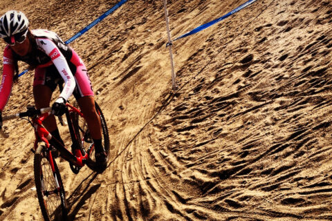 Racing cyclocross through the sand.