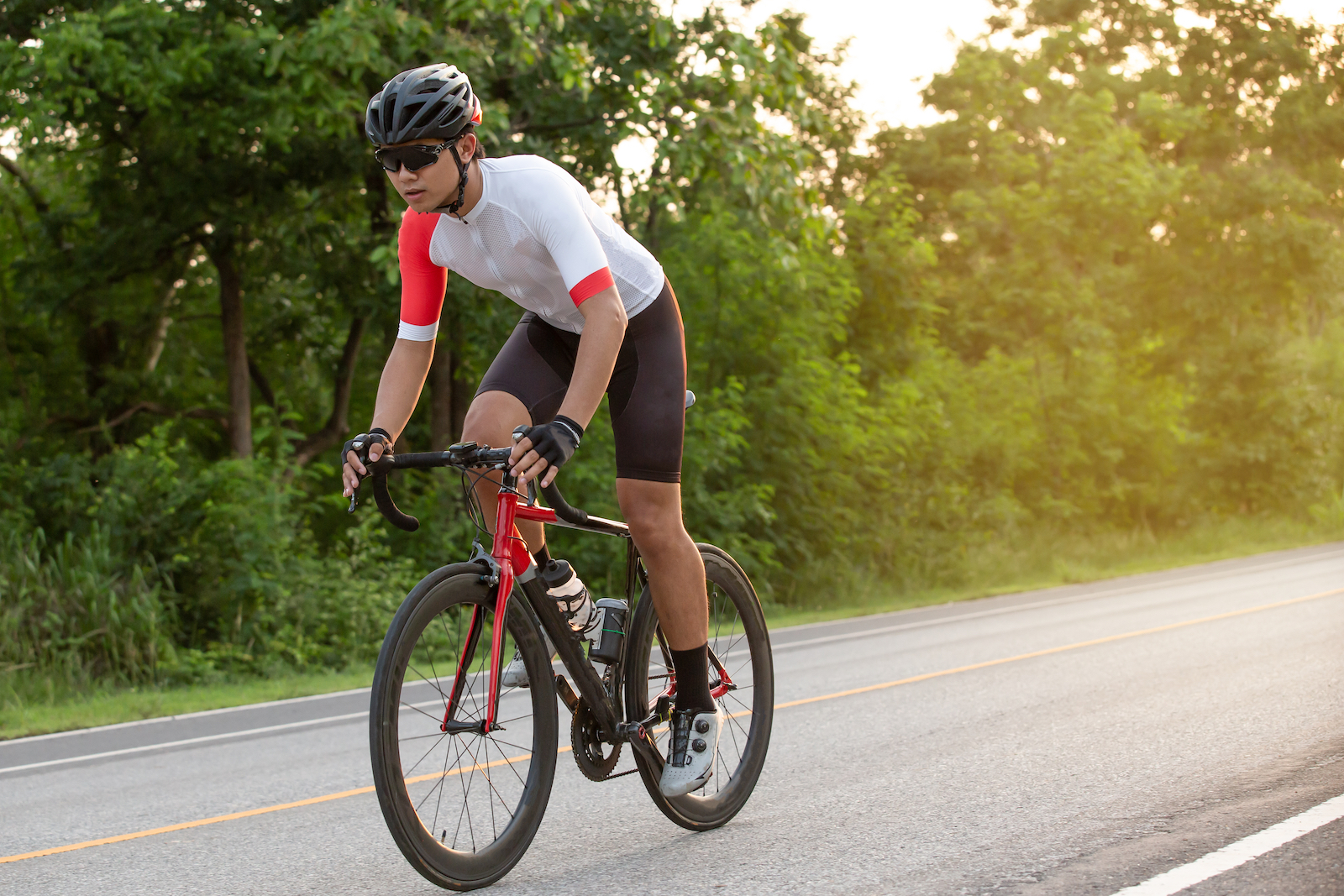 Man riding a bicycle in a park.